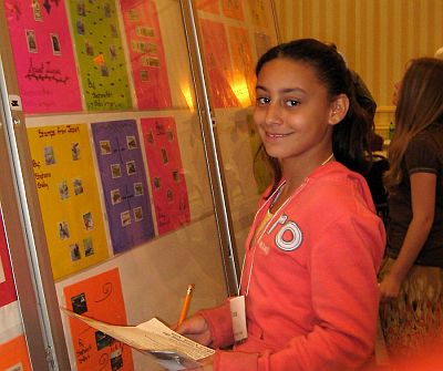 Fitch club member admiring exhibit by one of her friends