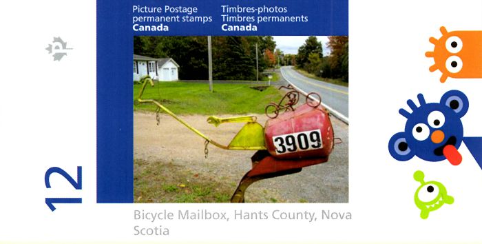 Booklet of Picture Postage stamps showing folk art mailbox with a bicycle model on top