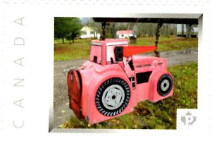 Picture Postage stamp showing folk art mailbox shaped as a tractor