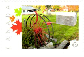 Picture Postage stamp showing folk art mailbox with seat and wheel and mailbox