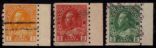 1 cent yellow, 2 cent carmine, and 2 cent green sidewise coil 
        stamps with a piece of selvedge attached to the right side of the stamp