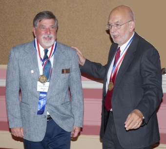 Bob Dyer congratulated by Bill Walton