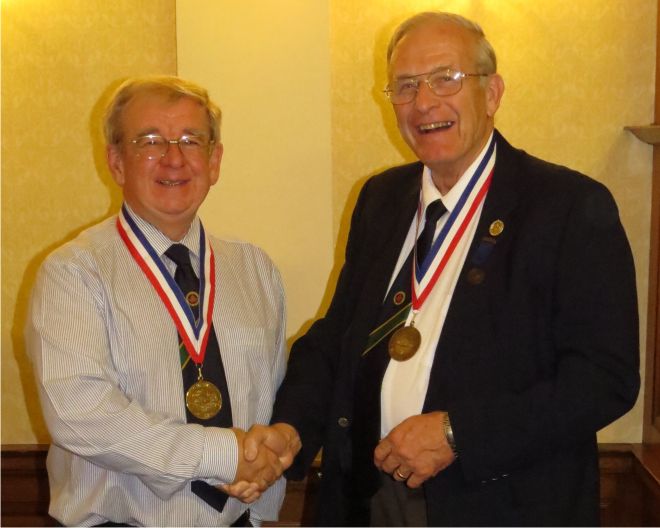 Brian Stalker receives OTB medal from Mike Street