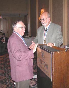 John Arn is congratulated by Bill Walton