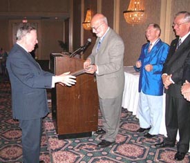Harry Sutherland receives the OTB Lifetime Achievement Award from Bill Walton on 27
                     September 2003 at BNAPEX 2003 in London, ON.