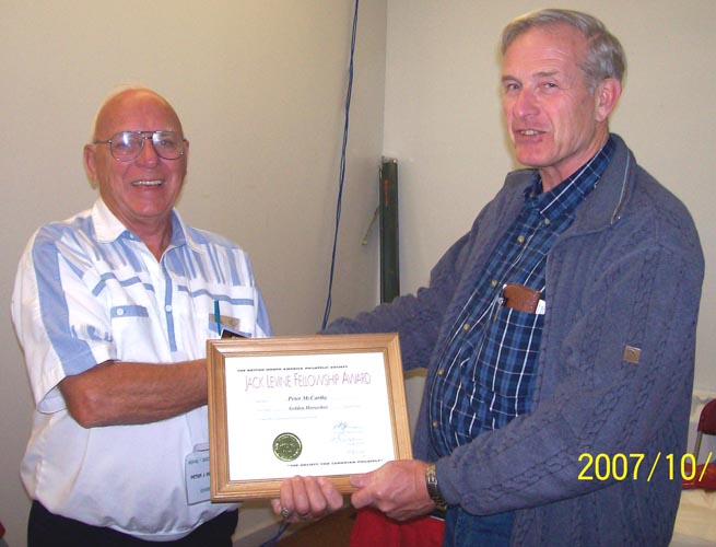 Mike Street presents Peter McCarthy with the Jack Levine Fellowship Award