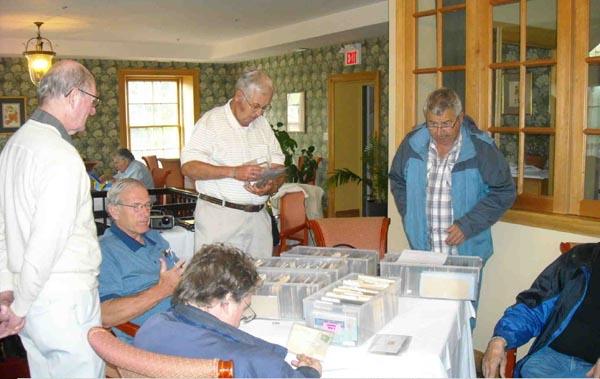 Clockwise around the table: Tony Hine
                (foreground), Derek Smith, Mike Street, John Irvine, Bob Vogel